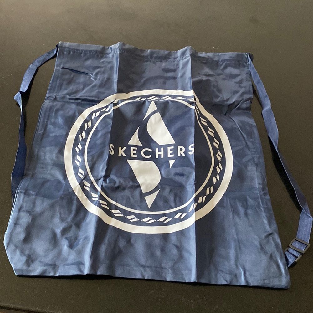 two Backpacks folds up small navy and white says Skechers on it brand new